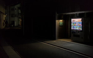 a vending machine sitting on the side of a road