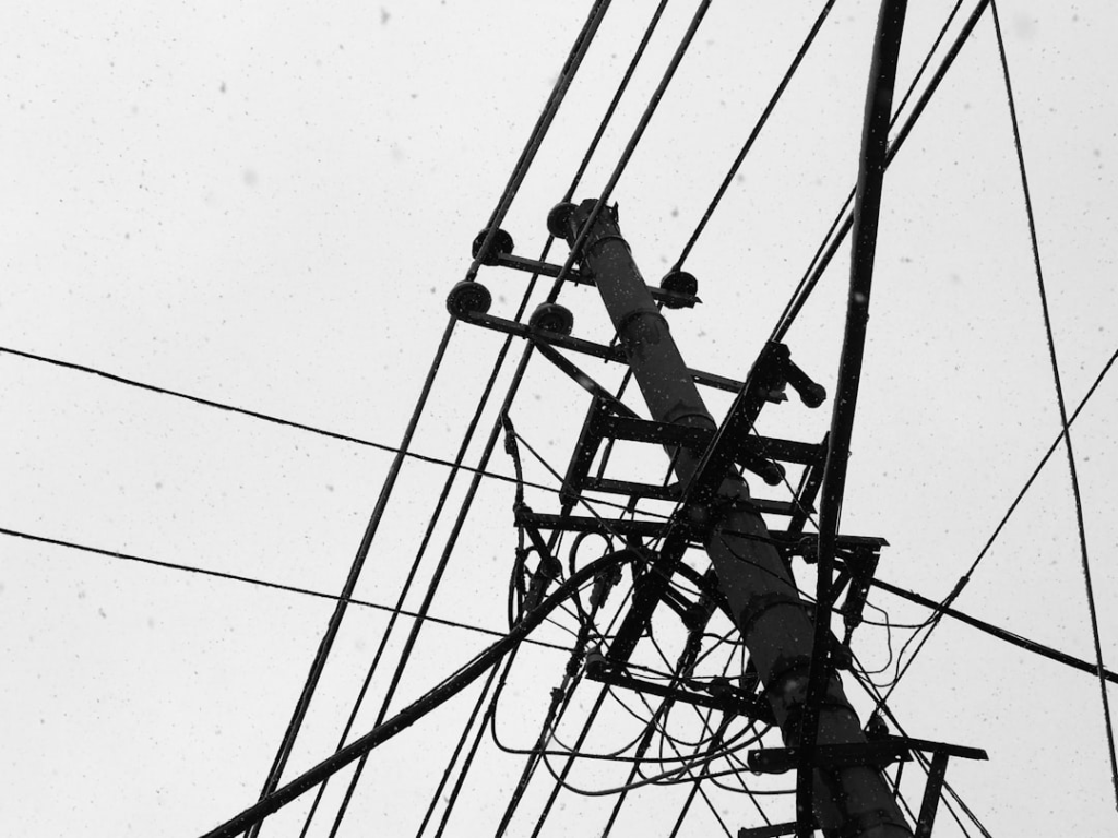 a black and white photo of power lines and wires