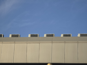 Air conditioning units on a building roof.