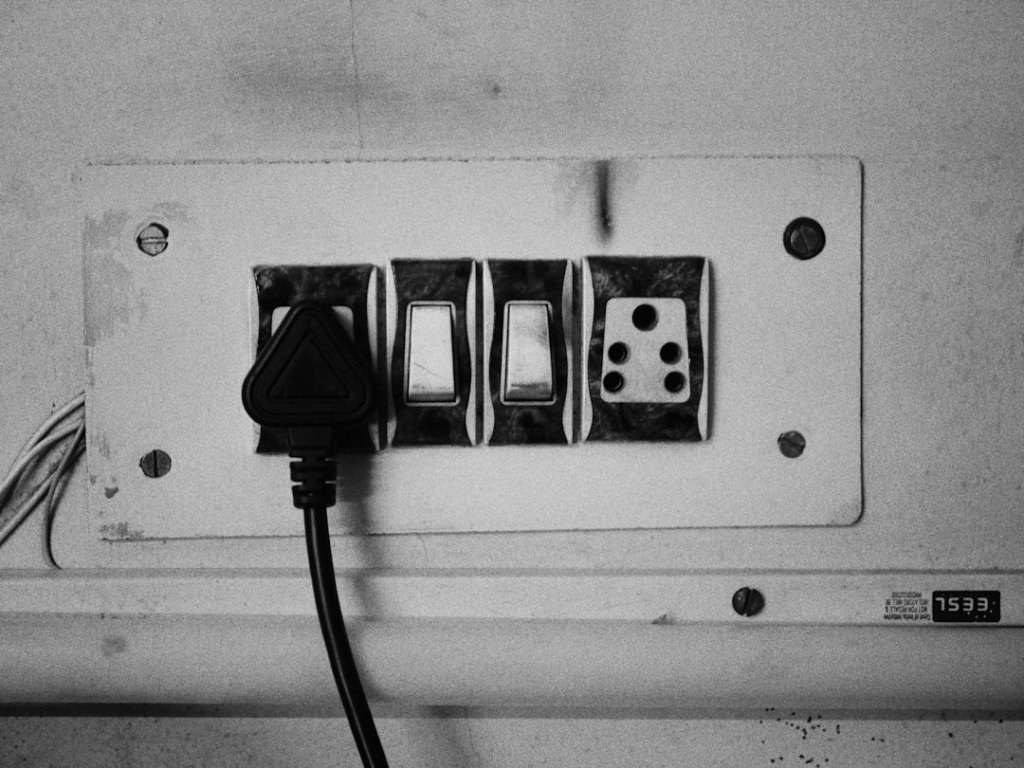 a black and white photo of an electrical outlet