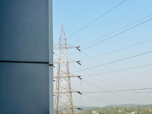 a view of a high voltage power line from a building