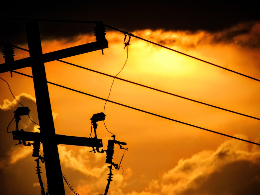 a group of telephone poles with wires