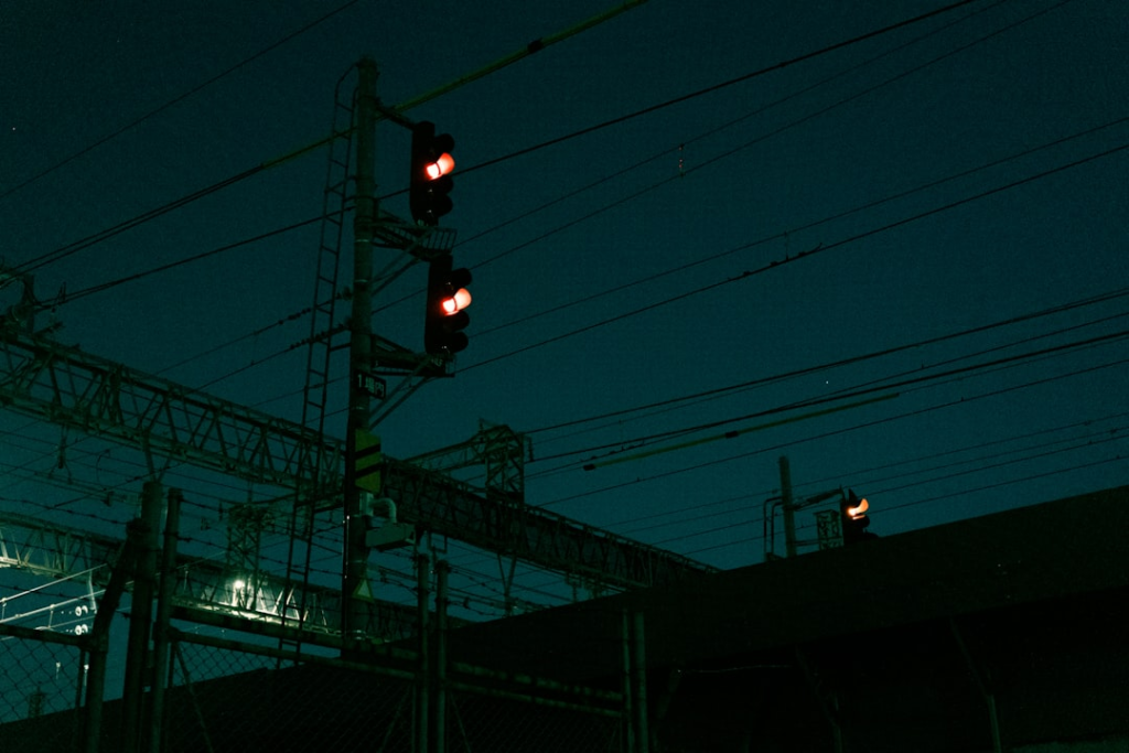 a traffic light is lit up at night